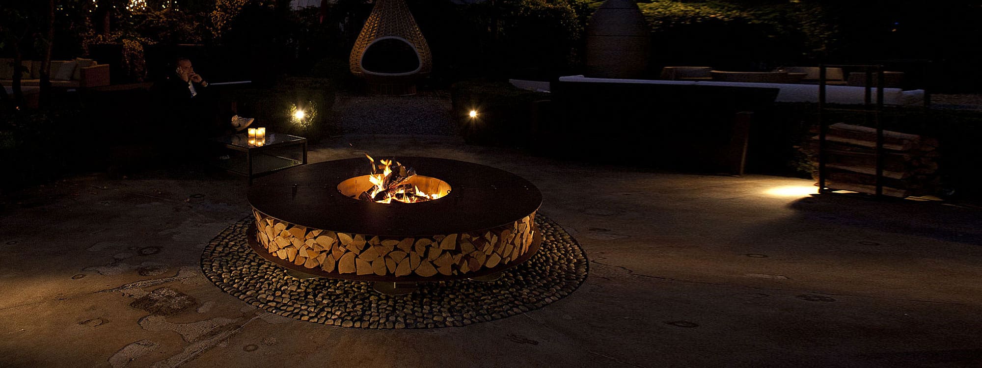 Night time shot of the dancing flames within Zero fire pit by AK47 fire pits, Italy.