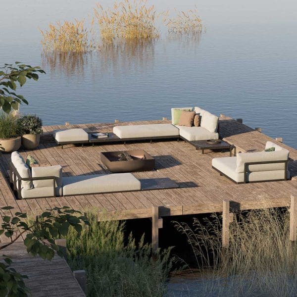 Image of Royal Botania Alura Lounge modern outdoor corner sofas on wooden decking with calm waters of a lake in the background