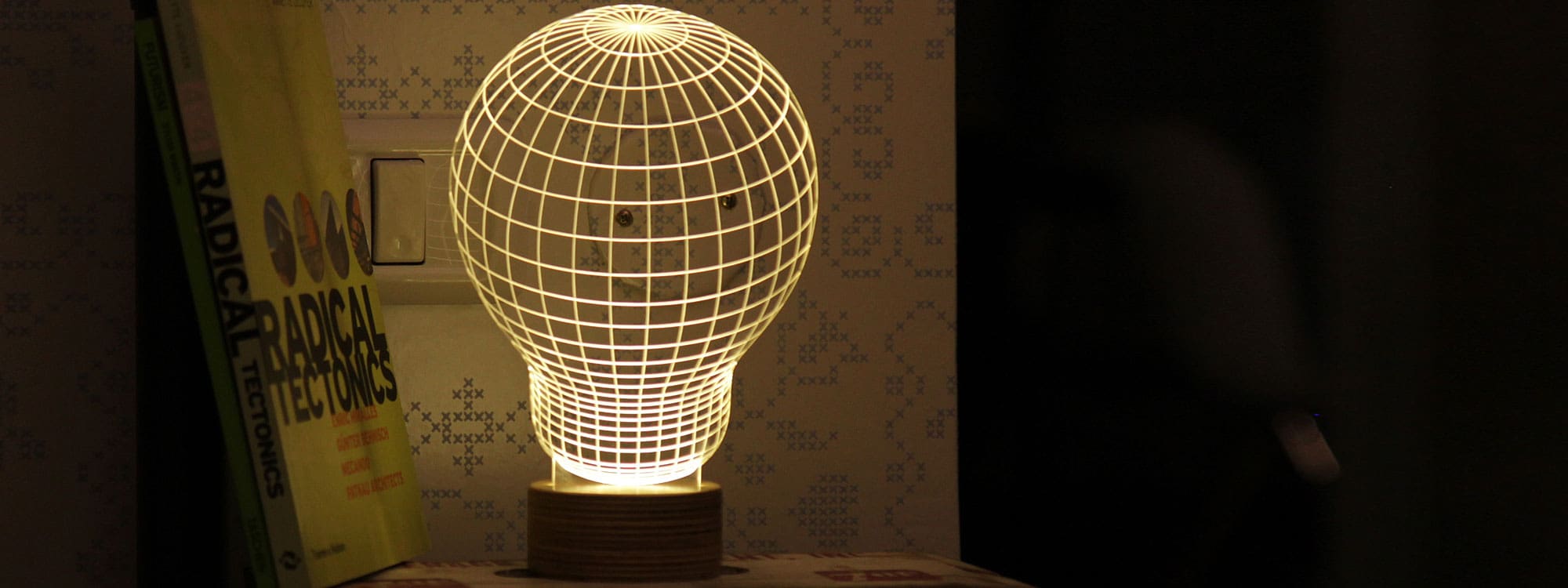Image of illuminated Bulb optical illusion LED light by Studio Cheha against dark background