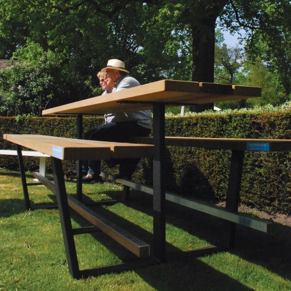 Image of long high bar table with benches, with black frame and iroko hardwood surfaces, by Cassecroute