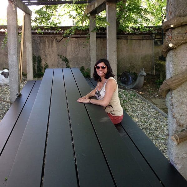 Image looking down the length of Cassecroute long picnic table in anthracite aluminium