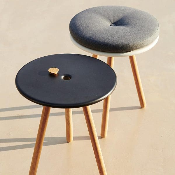 Image of pair of Cane-line Area round stools in black and white aluminium with teak legs