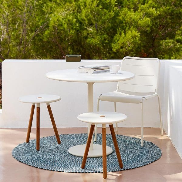 Image of Cane-line round garden table and stools in white aluminium and teak with Copenhagen white aluminum garden chair