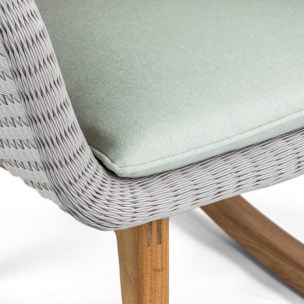 Image of detail of Shell rocking chair's woven Batyline fibre tub seat and teak sled legs by FueraDentro