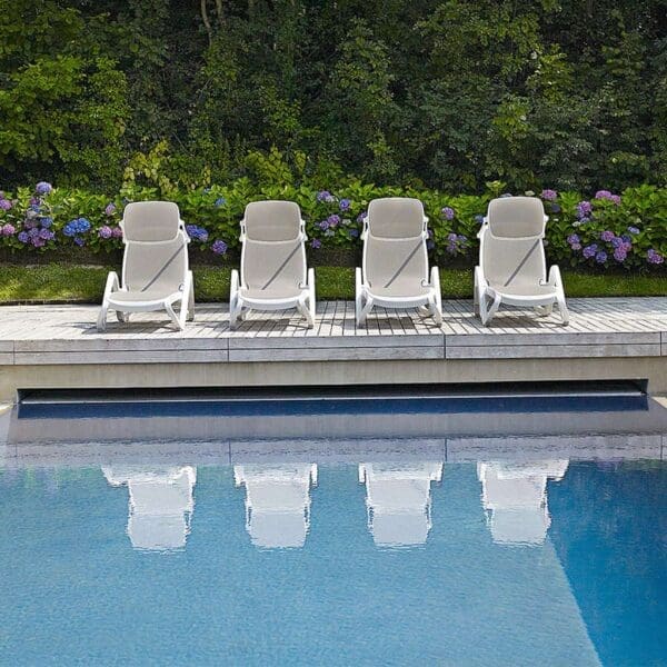 Image of row of Alfa white hotel sun loungers by Nardi, Italy.