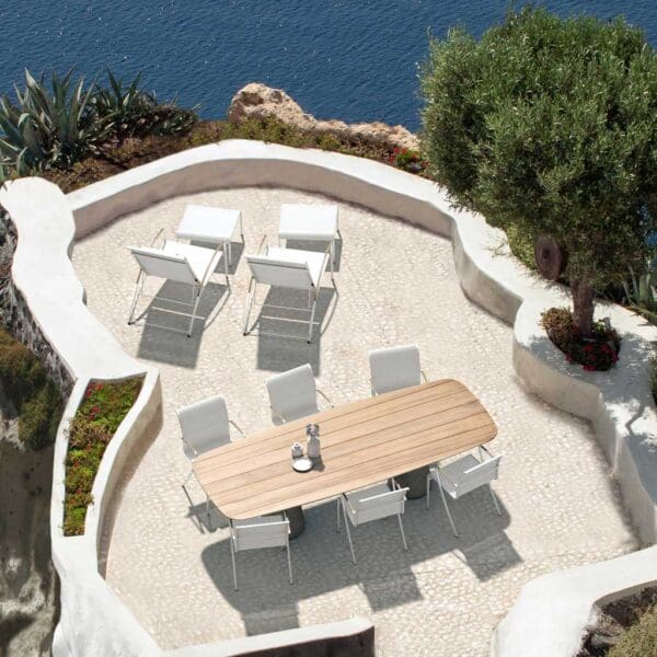 Image of Conix rectangular teak garden table & white QT chairs by Royal Botania