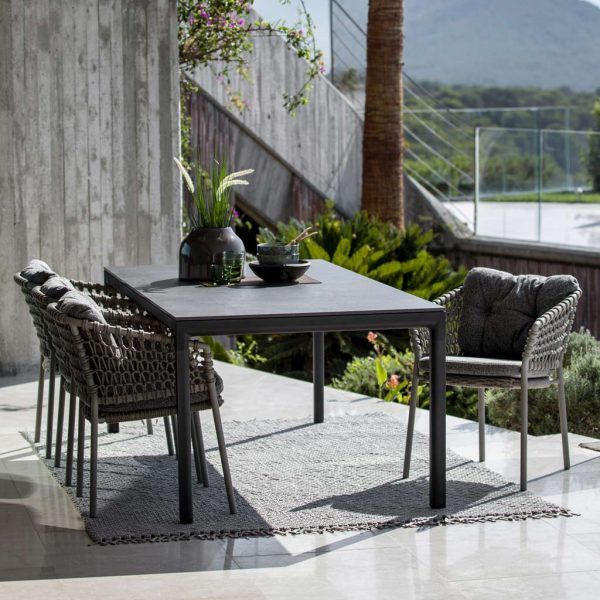 Image of dark-grey Ocean chairs and Drop ceramic garden table by Cane-line