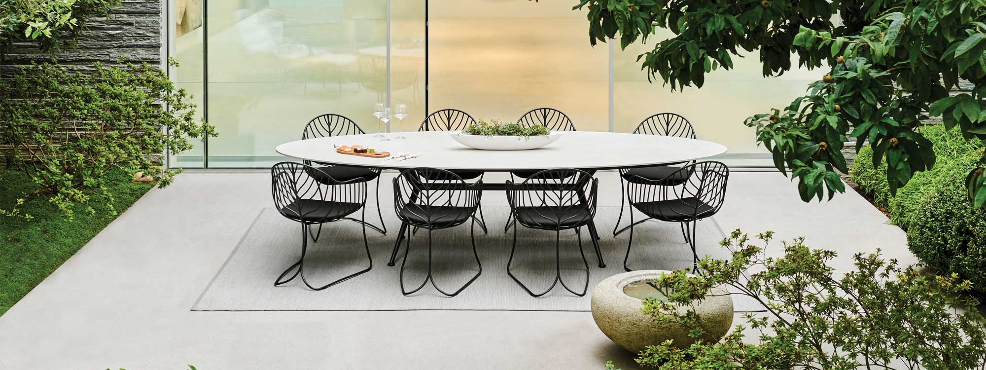 Exes & Folia dining set , organically inspired outdoor chairs & unique circular garden dining table by Royal Botania luxury garden furniture