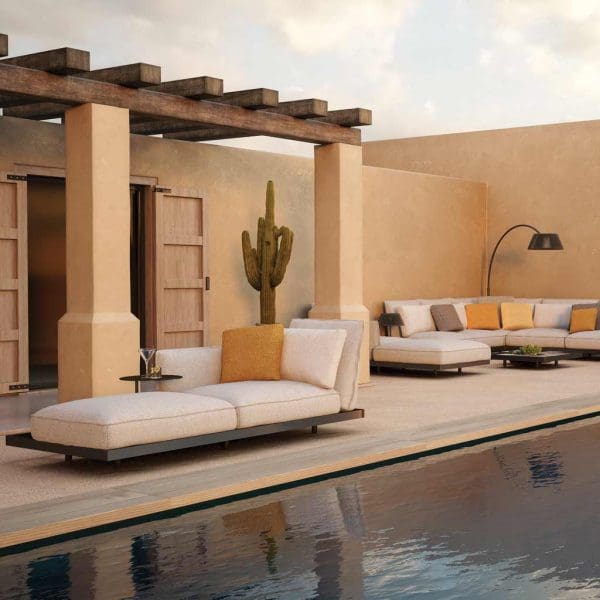 Image of Royal Botania Mozaix Alu daybed with Bronze frame and taupe cushions, alongside swimming pool