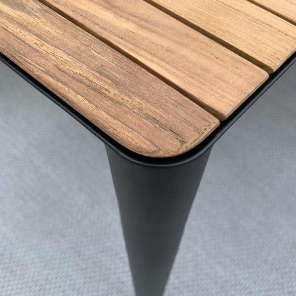 Detail of Royal Botania U-nite garden table's planked teak top and Anthracite aluminium leg