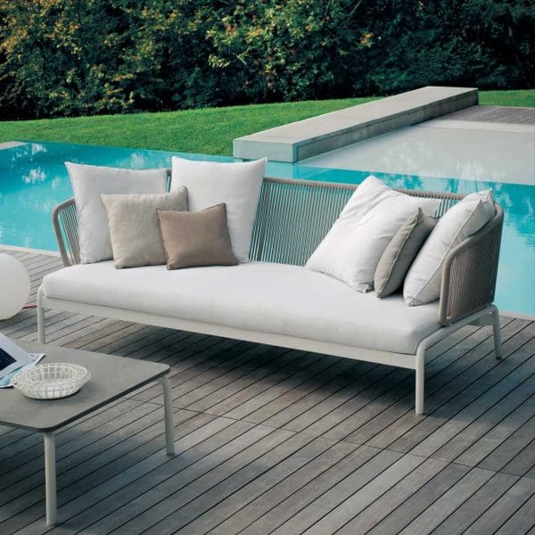 Image of Spool 3 seat contemporary garden sofa with milk-coloured frame and stone-coloured rope back, shown on poolside