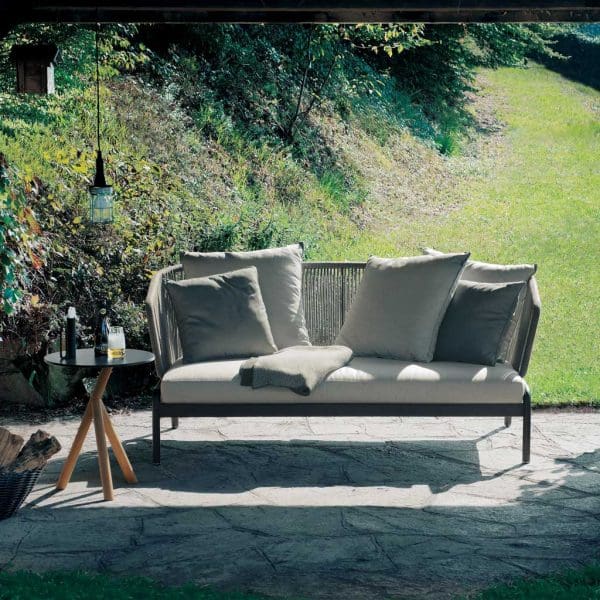 Image of RODA Spool 2 seater modern garden sofa on flag stone terrace