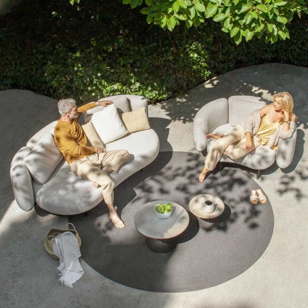Birdseye view of Royal Botania Organix sofas and Butler side tables on top of circular outdoor rug