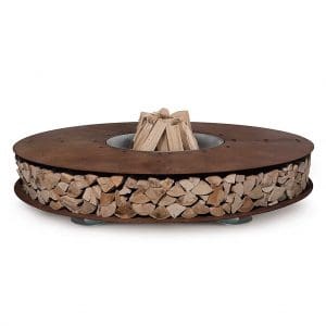 Studio image of AK47 Zero corten steel fire pit with logs ready to be lit inside burning chamber