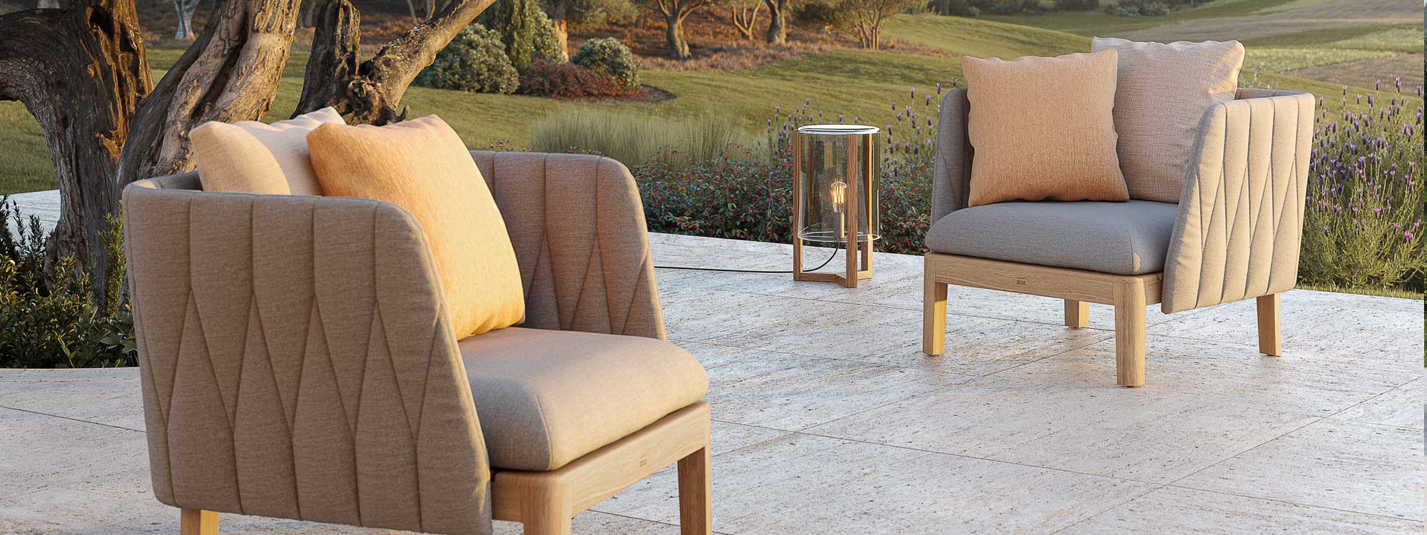 Image of Pair of Royal Botania Styletto garden lounge chairs on terrace in soft evening light