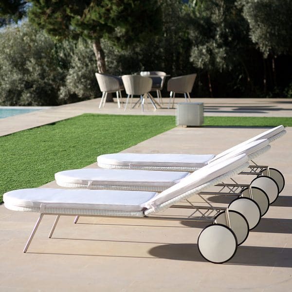 Image of row of 3 Shell modern sun loungers by FueraDentro, shown with white Batyline weave and electro-polished stainless steel frames
