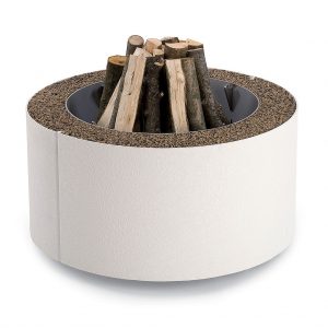 Image of white AK47 Mangiafuoco fire pit loaded with firewood ready to be lit