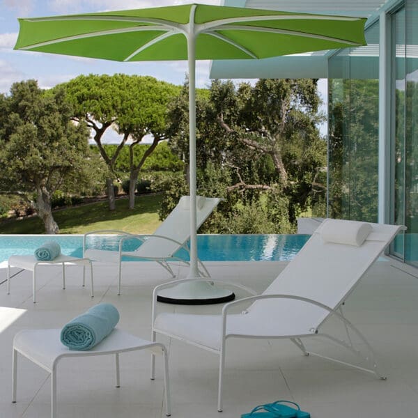 Image of pair of Royal Botania QT195 reclining garden chairs beneath green Palma parasol