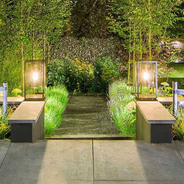 Image of pair of illuminated Royal Botana Dome Gate garden lights either side of garden steps, with nighttime garden in the background