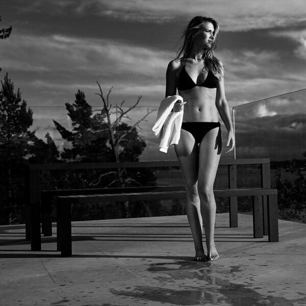 Monochrome image of bikini babe in front of Roshults Garden Dinner table & bench set