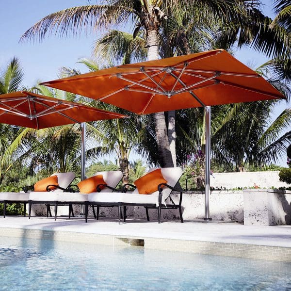 Image of Tuuci Ocean Master Max orange side post parasols with polished aluminum mast and ribs