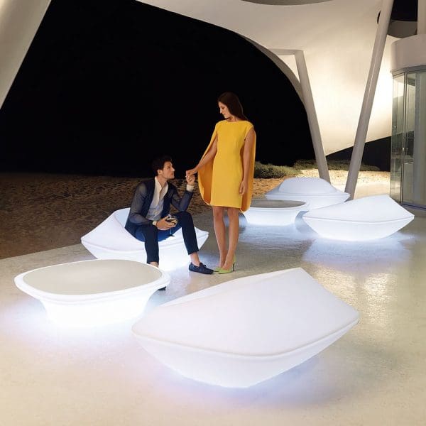 Nighttime image of illuminated UFO garden lounge furniture by Vondom