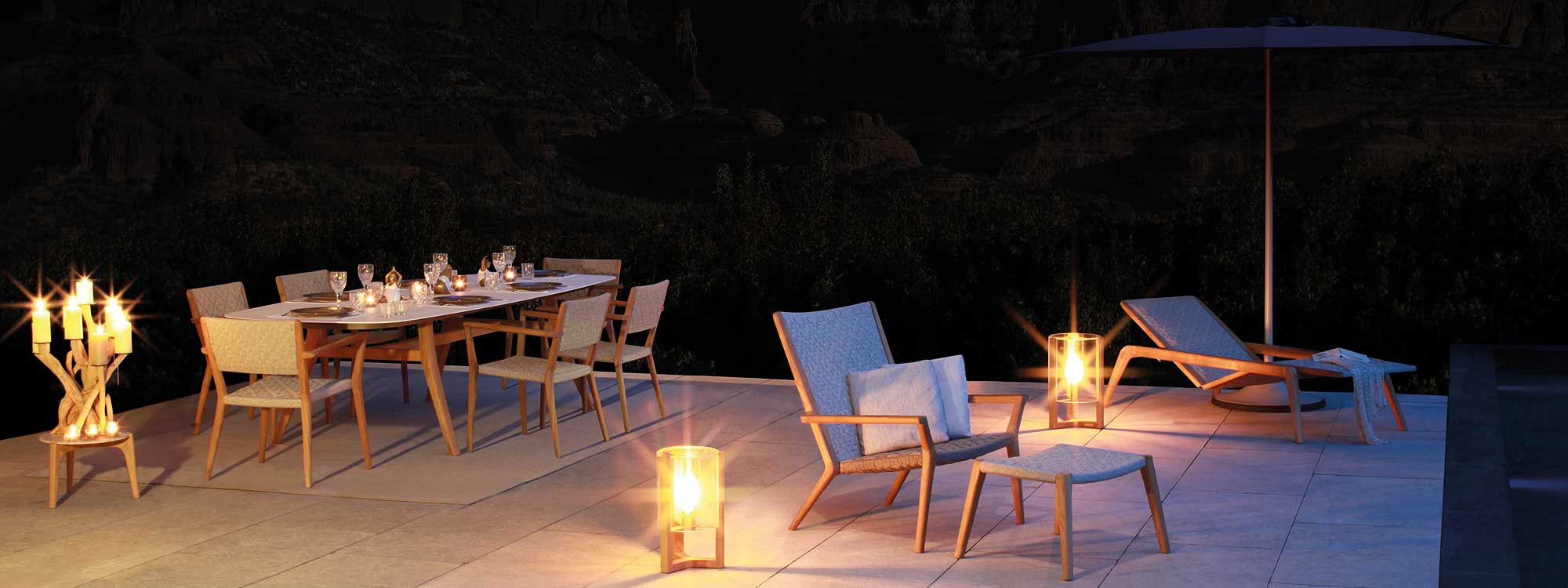 Night time shot of Royal Botania garden furniture on an exterior carpet