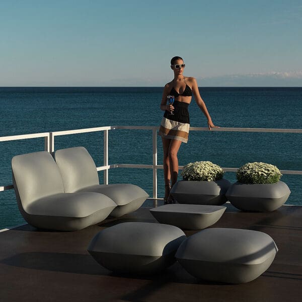Image of steel-coloured Vondom Pillow exterior lounge furniture on waterside balcony