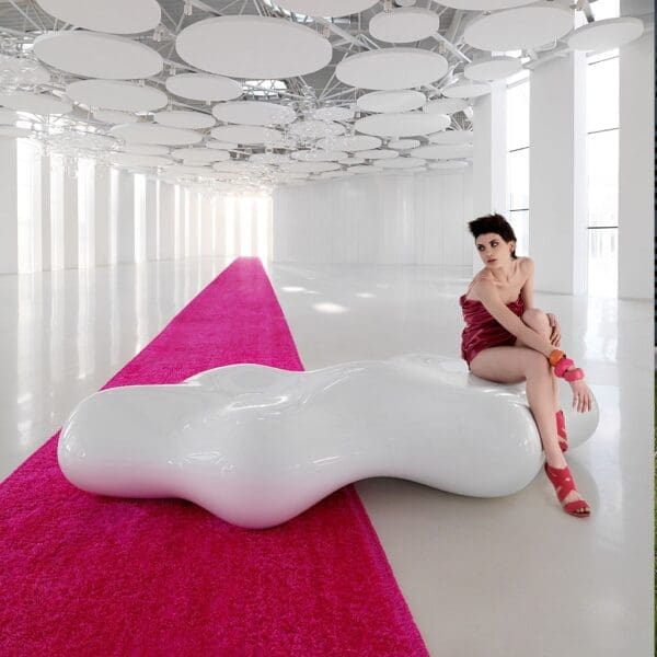 Interior image of woman sat on white lacquered Lava amorphous sculpture by Karim Rashid for Vondom