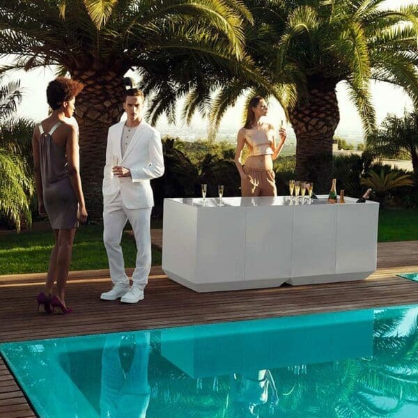 Image of young dudes on poolside gathered around Vondom Vela bar counter