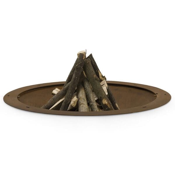 Studio image of AK47 Hole corten fire bowl with pile of logs ready to light