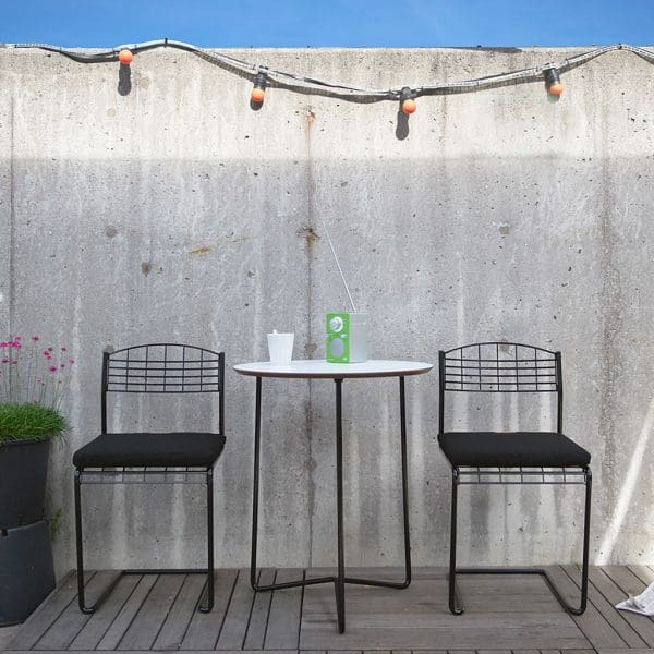 Image of pair of High Tech cantilever garden chairs and small circular table with black lacquered steel frames by Grythyttan Stålmöbler, Sweden