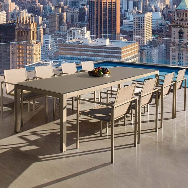 Image of New York rooftop installation of Alura and Taboela dining set in sand finish by Royal Botania outdoor furniture