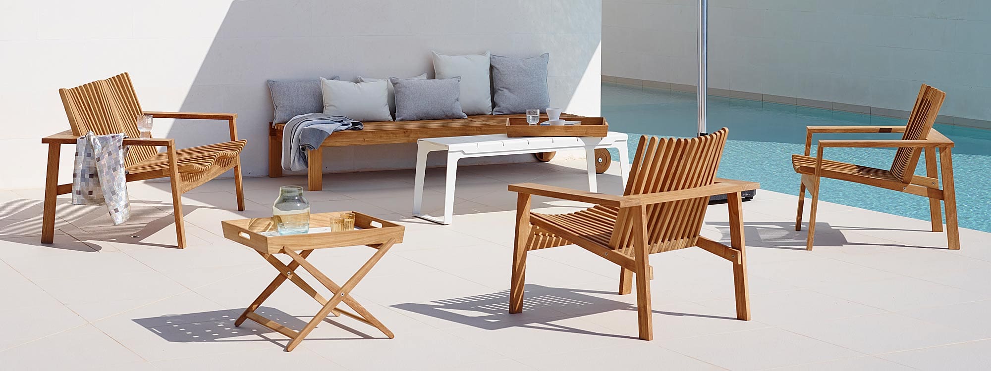 Image of Amaze teak sun lounger and 3 lounge chairs by Cane-line