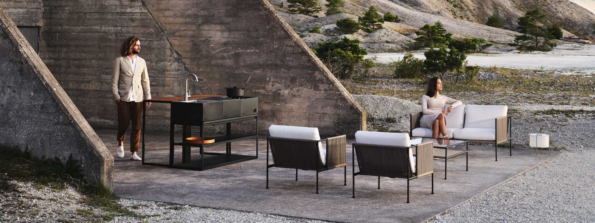 Image of Antibes contemporary garden furniture outside world war 2 concrete bunker with hillside and trees in the background