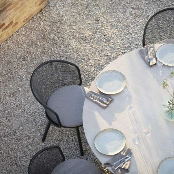 Image of birdseye view of Baza exterior dining chairs around Branta modern garden table