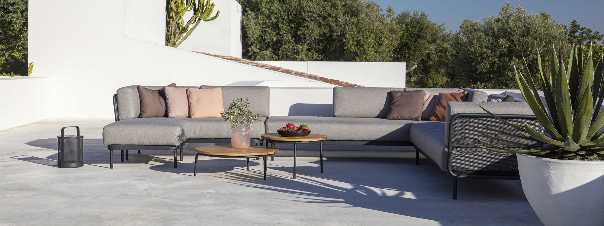 Image of Baza large garden corner sofa on whitewashed sunny terrace