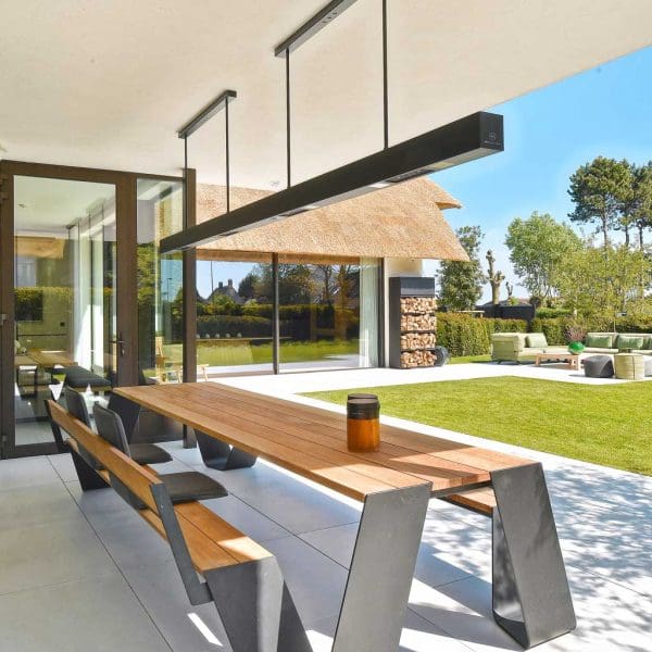Image of large Heatsail BEEM outdoor ceiling heater above picnic table on chic outdoor terrace