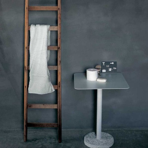 Interior image of Bernardo white pedestal coffee table designed by Rodolfo Dordini for RODA
