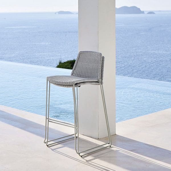 Image of pair of stacked Breeze exterior bar stools in white-grey Cane-line weave