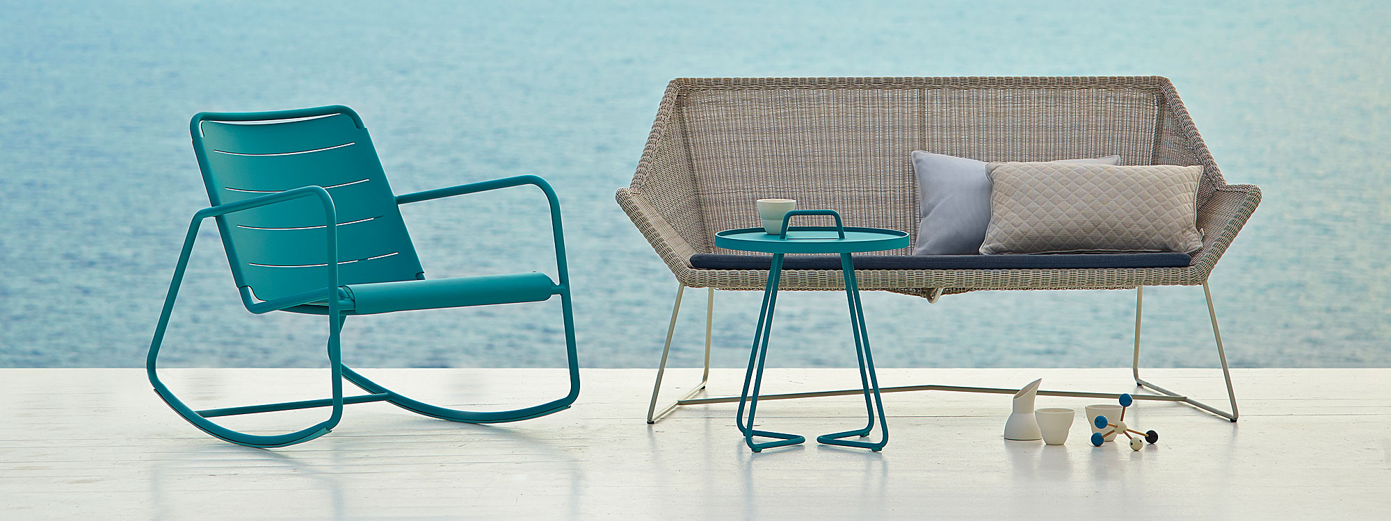 Image of grey Breeze sofa and aqua On The Move tray table by Cane-line garden furniture