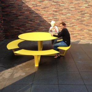 Image of mother and child sat on La Grande Ronde yellow modern picnic table by Cassecroute