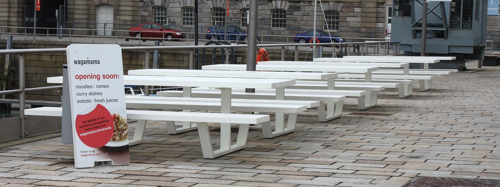 Image of Cassecroute white modern picnic furniture outside Wagamama in Plymouth historic dockyard