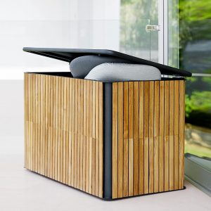 Image of Caneline Combine garden cushion box in anthracite aluminum with vertical teak slats.