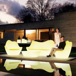 Nighttime image of white illuminated Sabinas plastic outdoor lounge set by Vondom