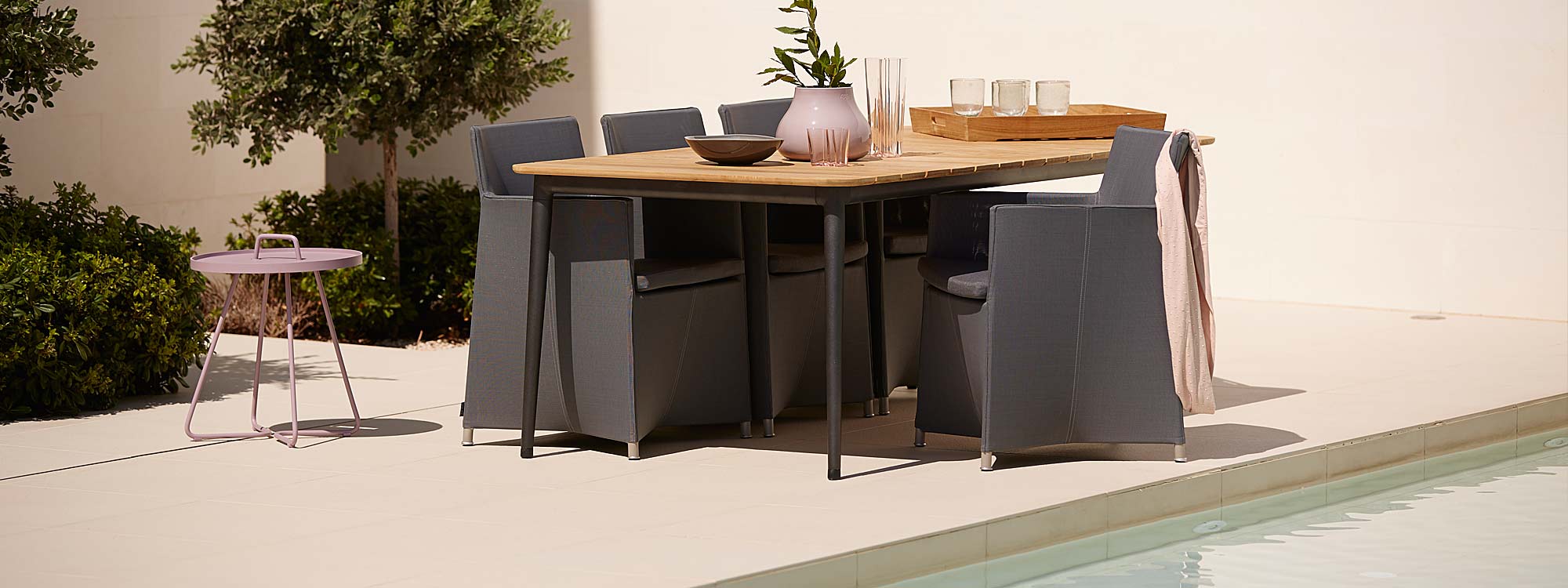 Image of Diamond dining chair with Core extending teak table with lava-grey aluminium base by Cane-line