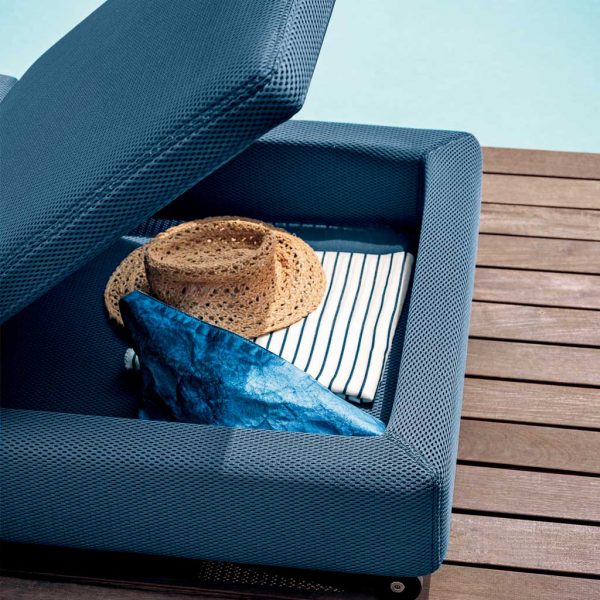 Image of storage space beneath Double sun lounger's adjustable back rest by RODA, with hat, towel and scarf inside