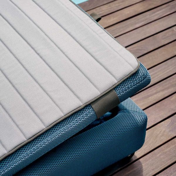 Image of detail of Double blue upholstered sunbed with grey cushion by RODA furniture