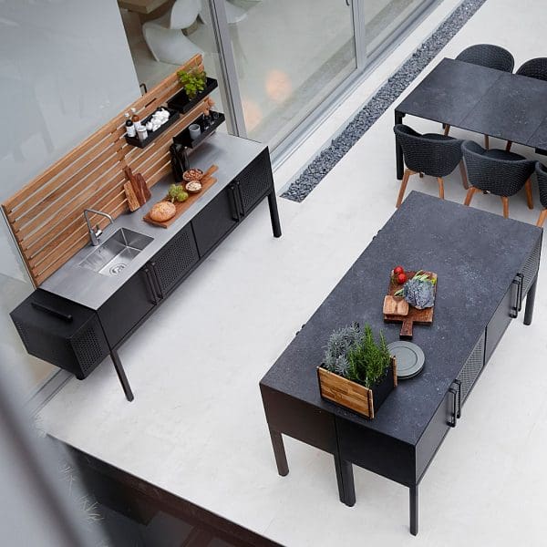 Image of aerial view of Drop garden kitchen island and Drop kitchen cabinet with teak trellis by Cane-line