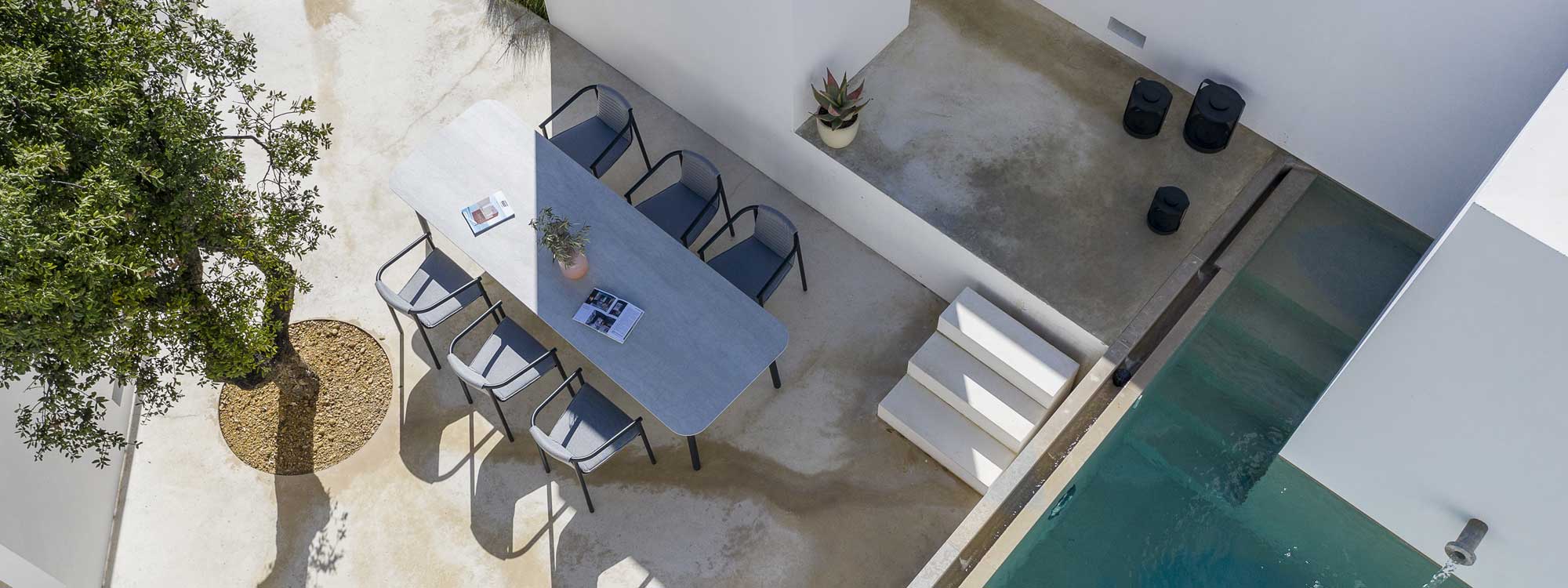 Image of birdseye view of Duct Round chair and Starling modern garden table on contemporary terrace